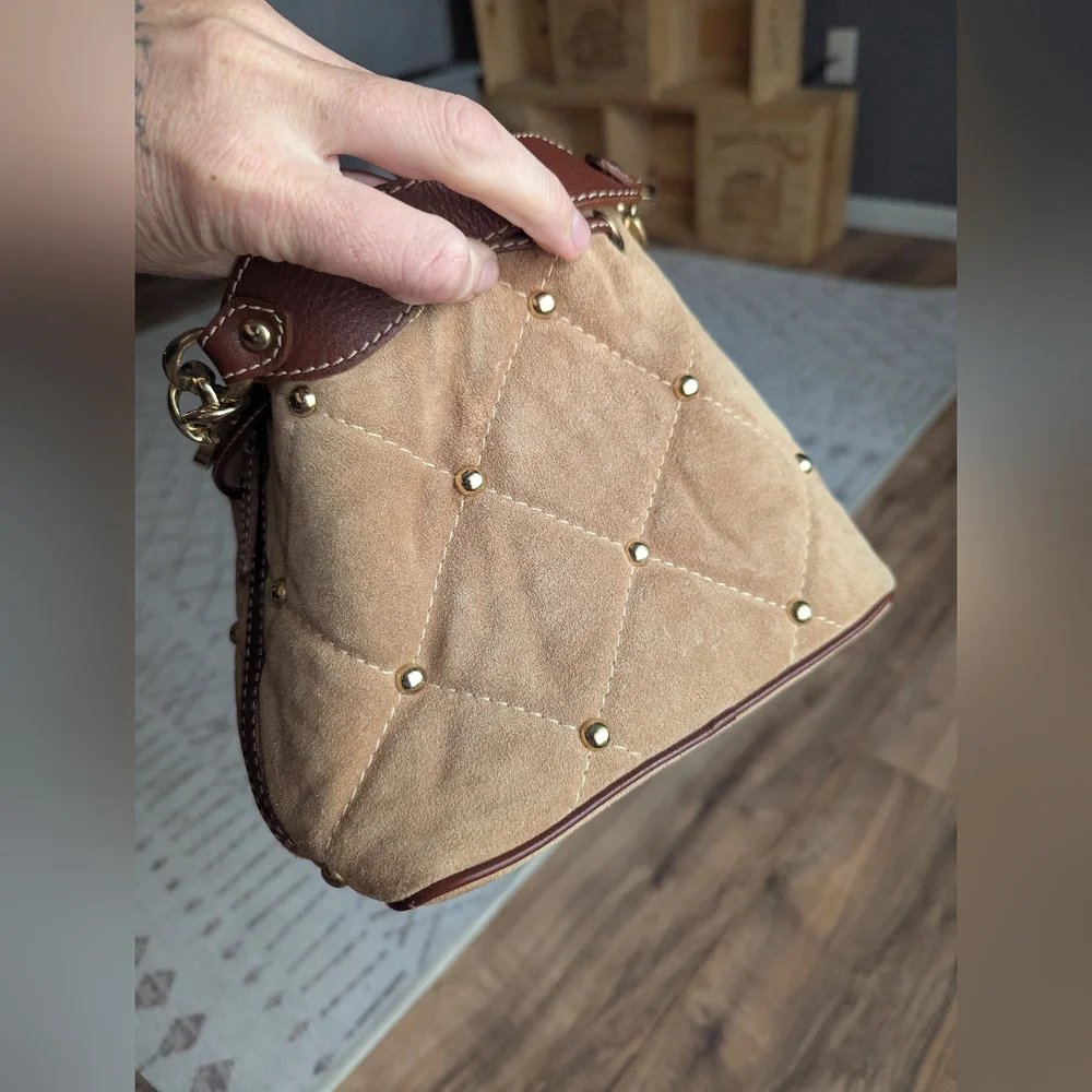 Claudia Firenze Leather Bucket Bag With Pull Top And Tassels.